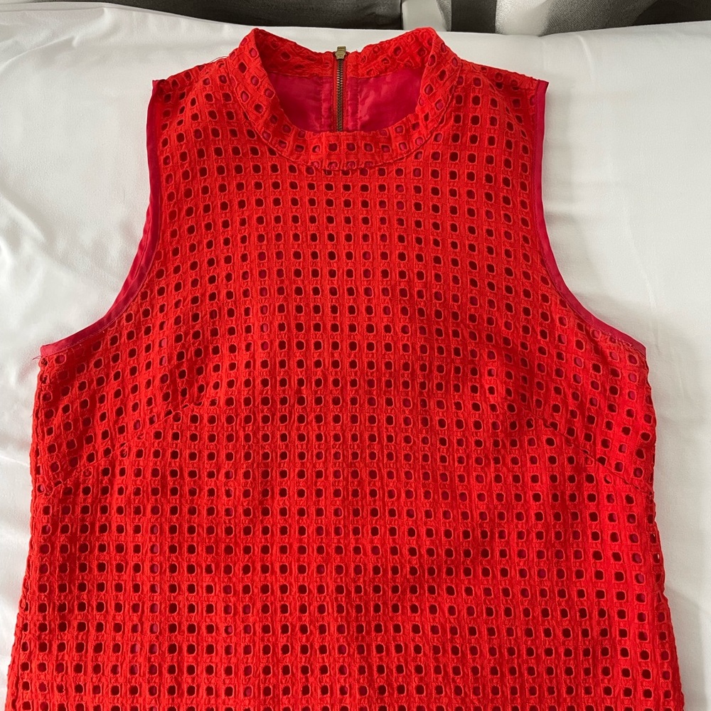 Orange eyelet sleeveless top